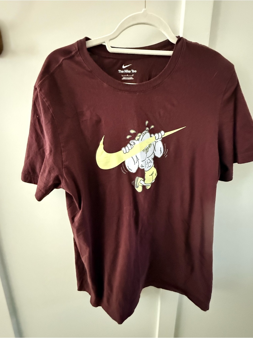 Nike Maroon Tee with Yellow Swoosh Character